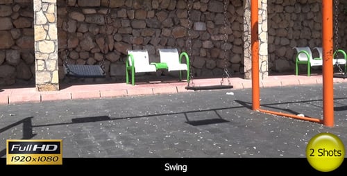 Empty Swings Gently Swaying in an Urban Park