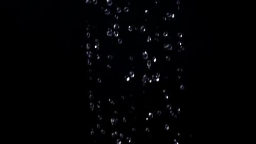 Water Droplets Falling on Black Background