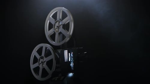 Vintage Film Projector Spinning Film in Smoky Room