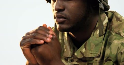 Thoughtful military soldier sitting