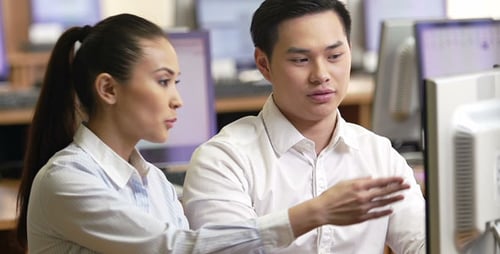 Teamwork at Computer in Modern Office
