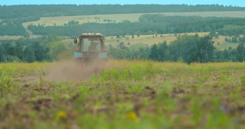 Tractor Works the Land Plows the Field