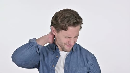 Young Adult Massaging Sore Neck Against White Backdrop