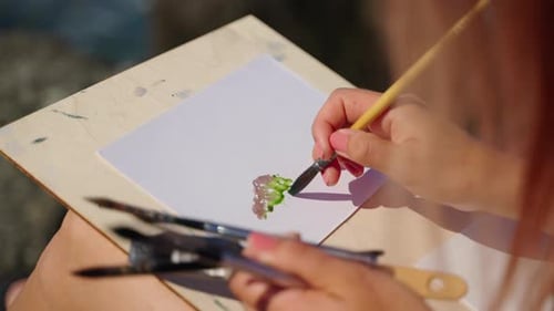 Woman Creates Watercolor Painting Outdoors