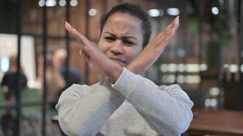 Woman Crossing Arms in Rejection and Denial