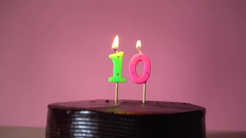 Lighting Tenth Birthday Cake Candles with Lighter
