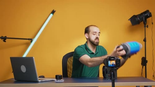 Man Demonstrates Video Light Component Assembly