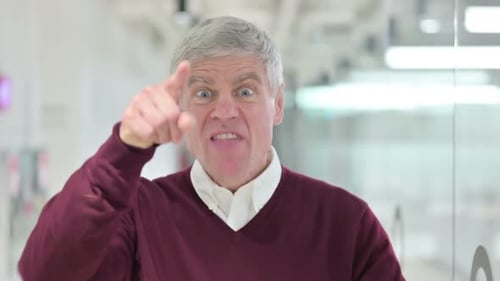 Angry Man Yelling and Pointing at Camera
