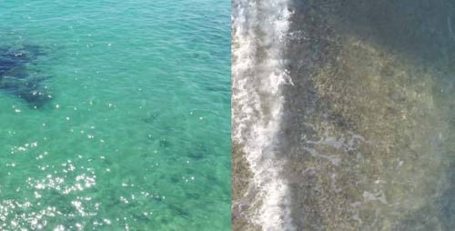 Aerial View of Turquoise Ocean Meeting Sandy Beach