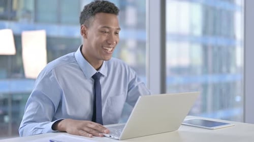 Young Man in Office on Video Conference Call
