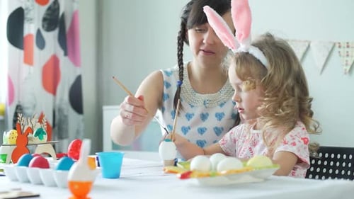Woman and Her Daughter Preparing for Easter