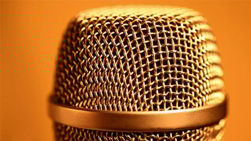Microphone Close Up on Orange Background