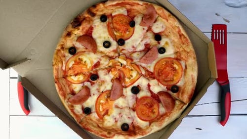 Overhead view of pizza in a box