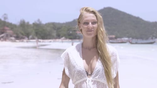 Girl Walking On The Beach