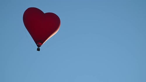 Red Heart Balloon Soaring in the Sky
