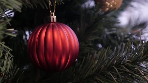 Artificial branch with detailed bauble 4K 2160p 30fps UltraHD footage - Red decorative ornament hang