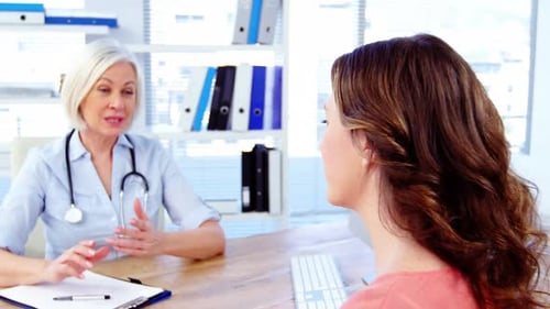 Doctor and Patient Discussing Healthcare in Office