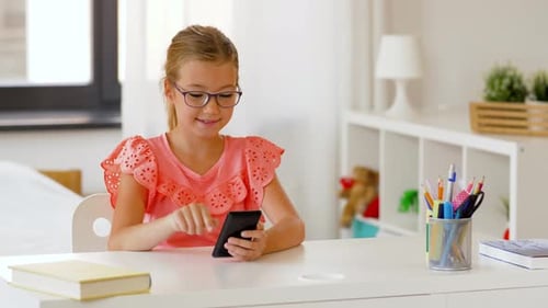 Girl Using Smartphone at White Desk