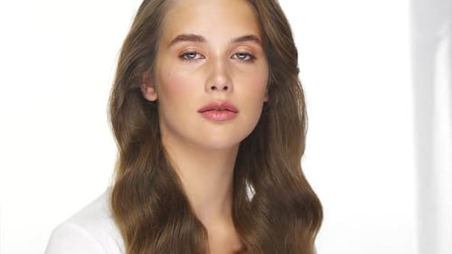 Woman Portrait with Long Wavy Hair Smiling