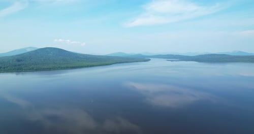 Flying Over a Mountain Lake in the Morning