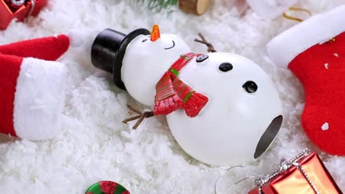 Different Christmas Objects Lay Out on Snow Background