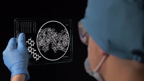 Medical Researcher Examining Data on Digital Tablet