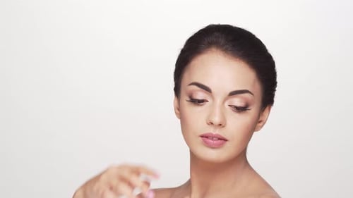 Studio portrait of young and beautiful brunette woman over