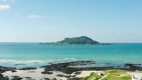 Landscape with tropical trees, waves and islands. Jeju Island.
