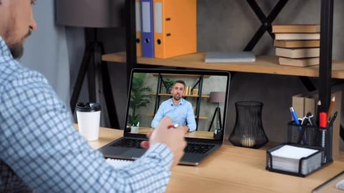 Businessman in Office Study Business Online Course Lesson Writes in Notebook