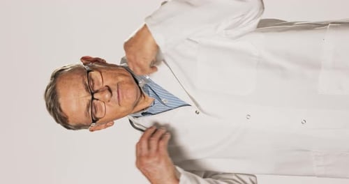 Doctor Puts on Stethoscope in Close Up Shot