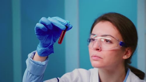 Scientist Examining Blood Sample in Test Tube