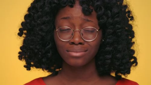 Young Woman Contemplating with Expressive Facial Gestures