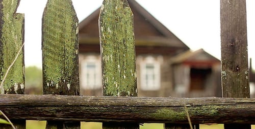 Wooden Fence And Village House