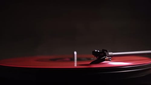 Red Vinyl Spinning on Record Player