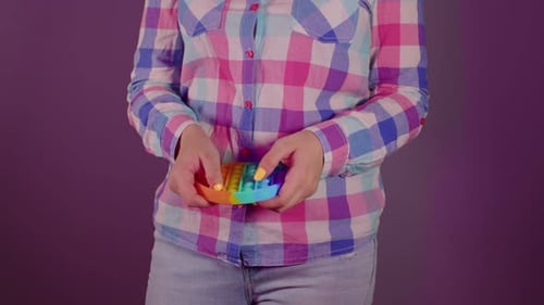 Close Up of Unrecognizable Person Playing with Pop It