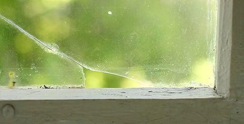 Cracked Village House Window