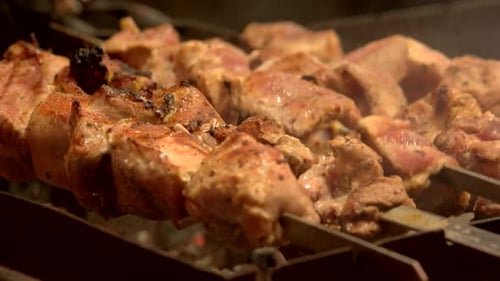 Juicy Meat Roasting Over Hot Coals on Skewers