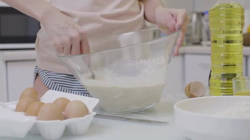 Woman Baking in Bright Modern Kitchen
