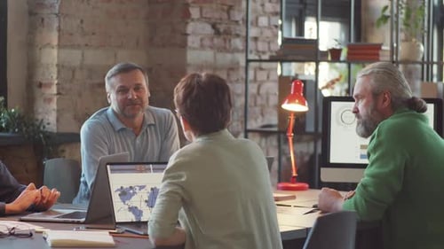 Colleagues Discussing Business in Office