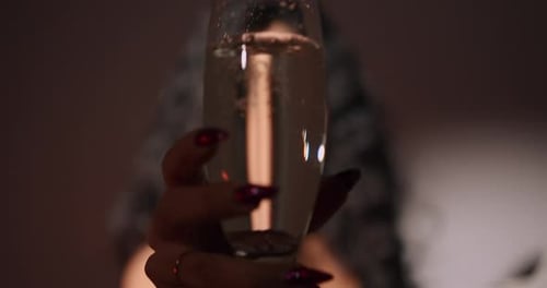 Elegant Woman Drinks Champagne, Close Up