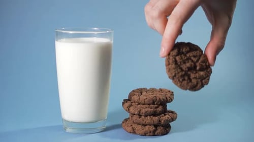 Dunking Chocolate Cookie into Milk, Food Still Life