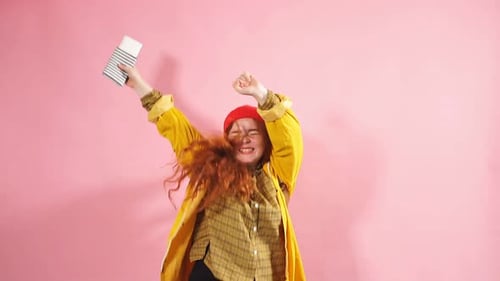 Ecstatic Woman Celebrates Holding Travel Tickets