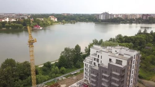 Aerial View of Tower Crane and Residential Building Under Construction