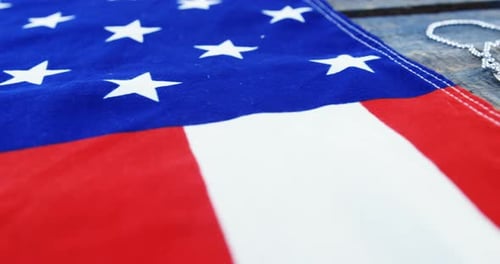 American Flag and Military Dog Tags on Wood