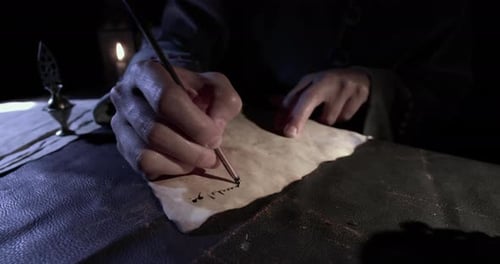 Person Writes With Quill By Candlelight