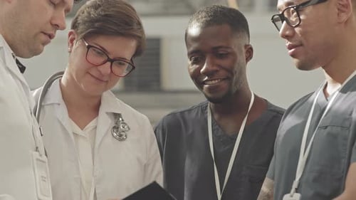 Multiethnic Medical Team Having Discussion in Clinic