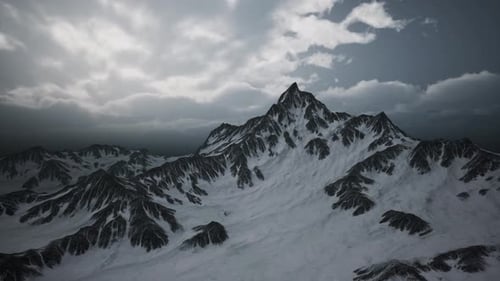 Snowy Mountain Range Panorama Under Cloudy Sky