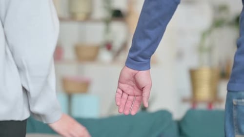Close Up of Man Holding Hands of Woman