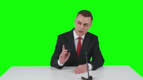 Man Giving Presentation Against Green Screen Background