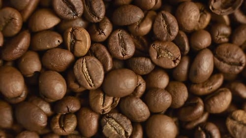 Top View Roasted Coffee Beans Close-up. Mixed Dark Coffee Close-up